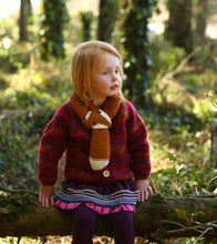 Girl wearing hand knitted Picaloulou merino fox scarf